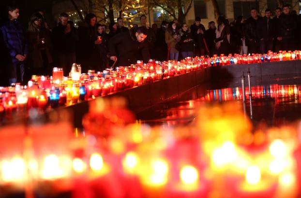 Bosnian Croats pray and light candles for the convicted general Slobodan Praljak, who killed himself seconds after the verdict in the U.N. war crimes tribunal in The Hague, in Mostar