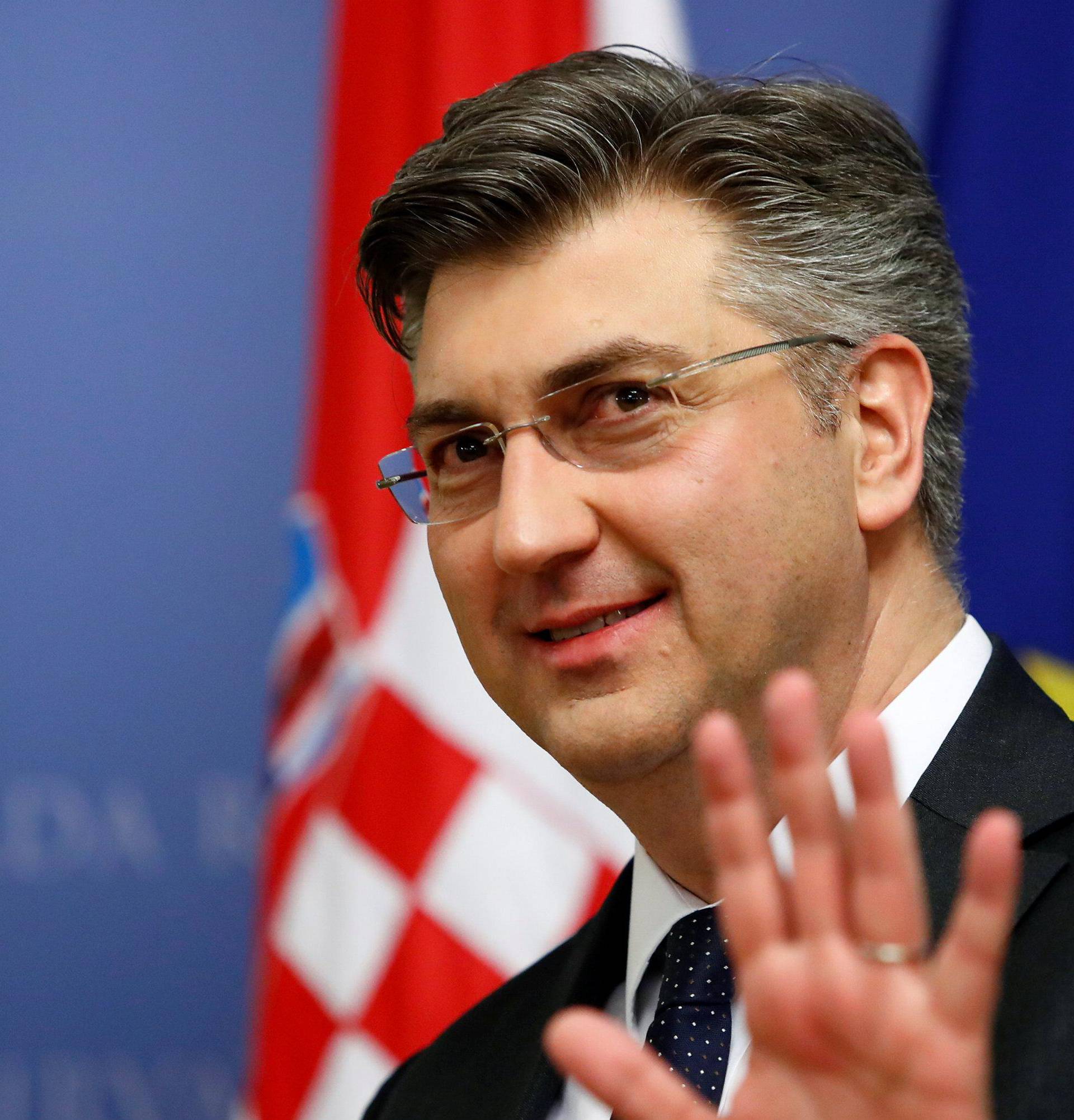 Croatia's Prime Minister Andrej Plenkovic gestures in a government building in Zagreb