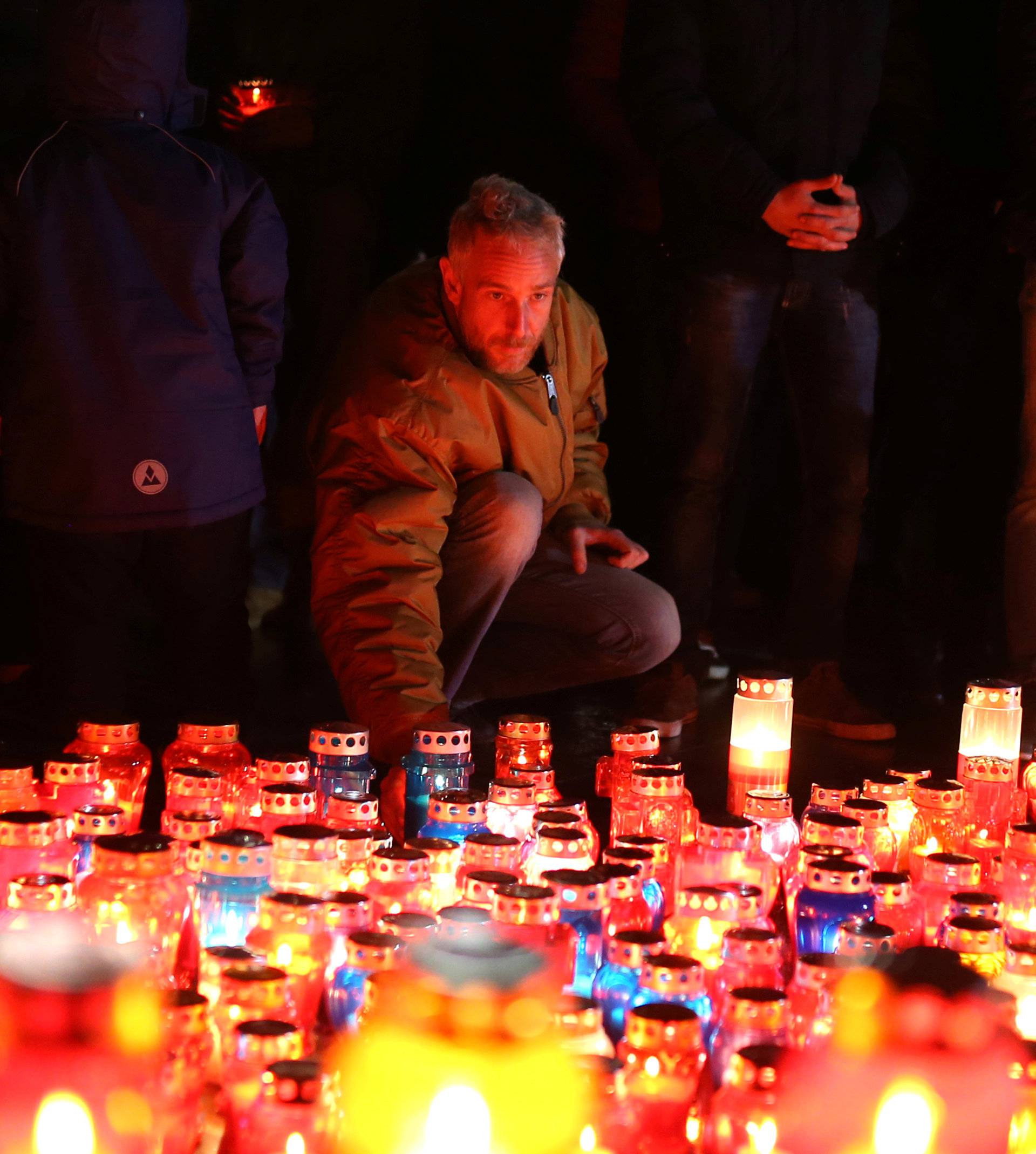 Bosnian Croats pray and light candles for the convicted general Slobodan Praljak, who killed himself seconds after the verdict in the U.N. war crimes tribunal in The Hague, in Mostar