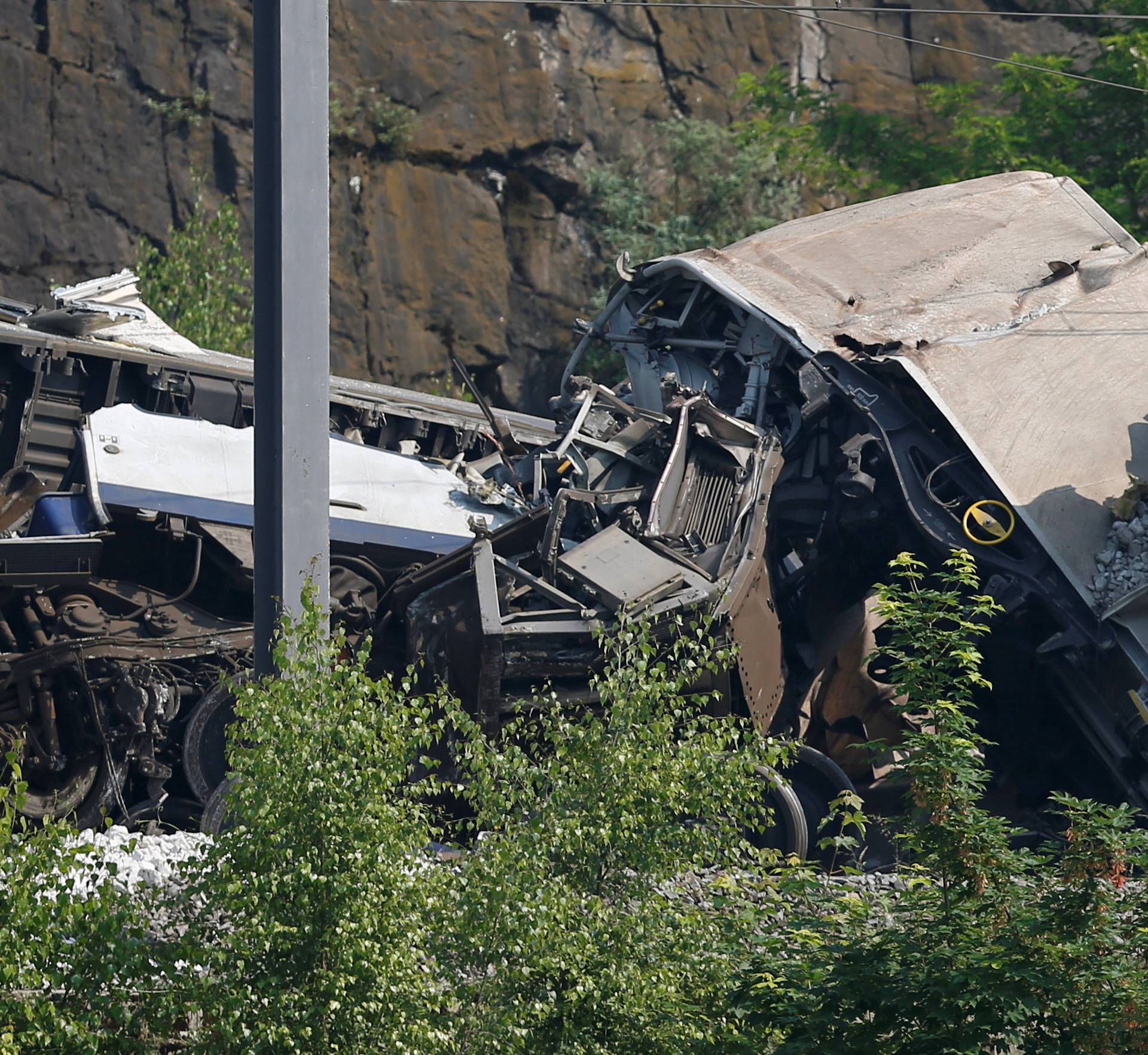 The wreckage of a passenger train is pictured after it crashed into the back of a freight train in the eastern Belgian municipality of Saint-Georges-Sur-Meuse