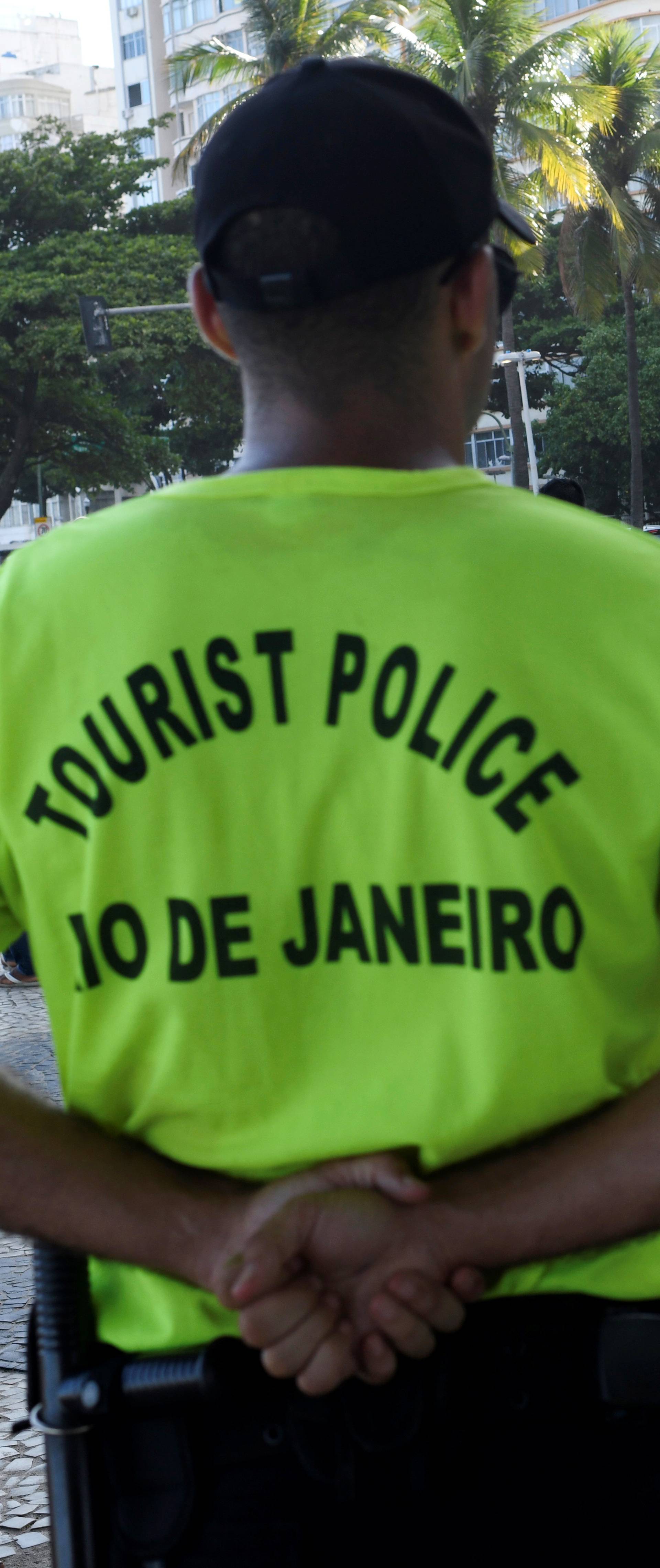 Tourist police officers stand guard at the Copacabana beach in Rio de Janeiro