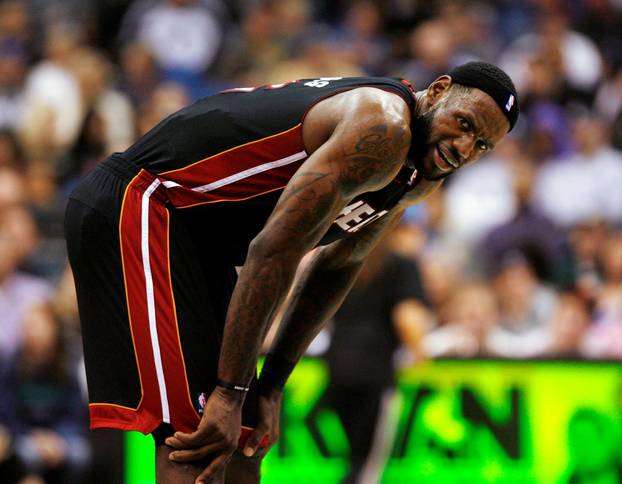 FILE PHOTO: Miami Heat forward LeBron James stands at midcourt during his side's 111-92 victory against the Minnesota Timberwolves at the Target Center in Minneapolis, Minnesota.