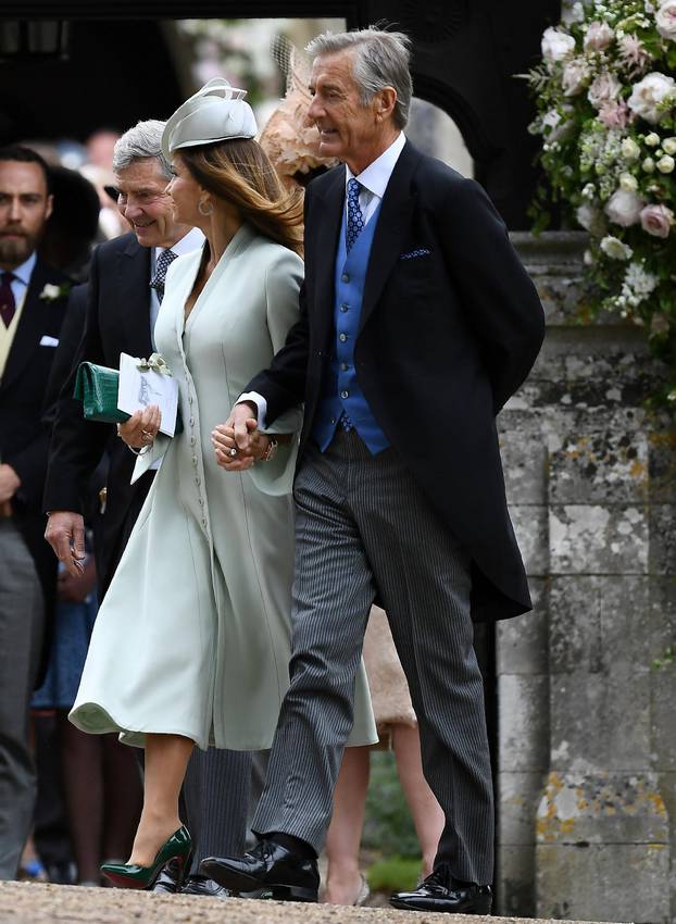 FILE PHOTO: FILE PHOTO: Carole Middleton and her husband Michael Middleton leave after attending the wedding of their daughter Pippa Middleton to James Matthews at St Mark