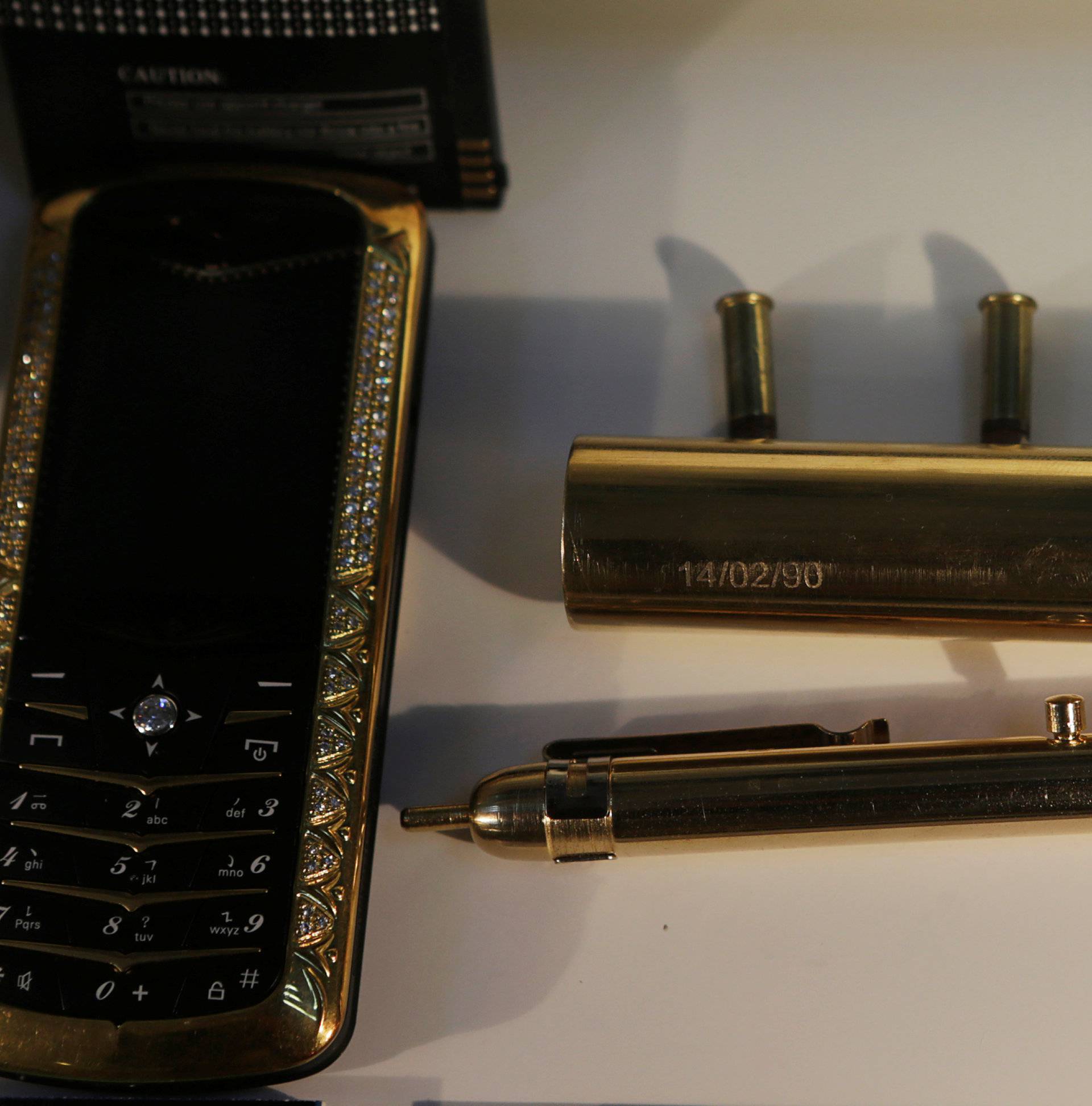 A mobile phone with gold incrustations and  jewellery is displayed in the Drugs Museum, used by the military to showcase to soldiers the lifestyles of Mexican drug lords, at the headquarters of the Ministry of Defense in Mexico City