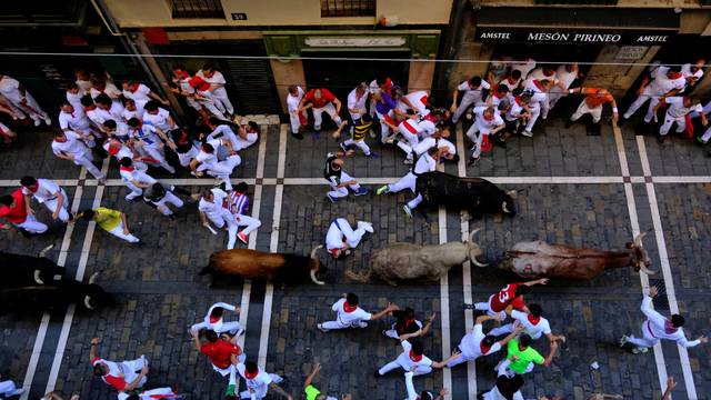 The Wider Image: A century on, Hemingway's prose lures revellers to Spain's Pamplona