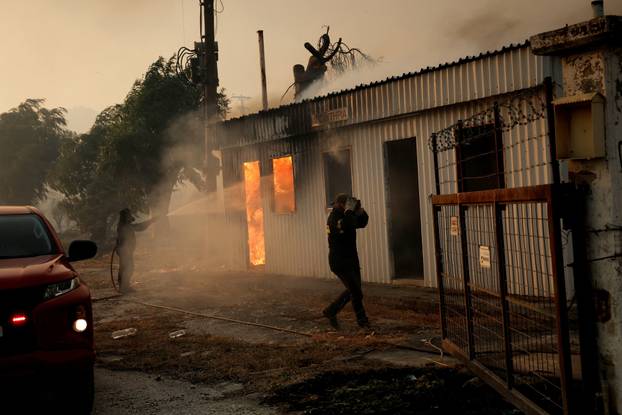 Wildfire burns houses, factories, forcing evacuations near Patras