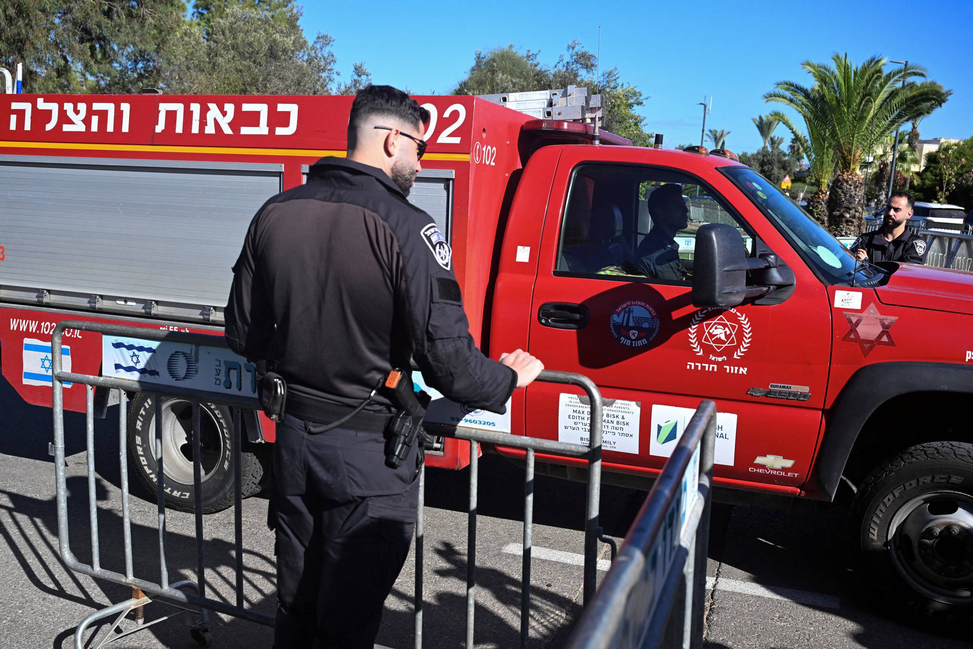 Israeli rescue and police seen on street in Caesarea following drone attack from Lebanon