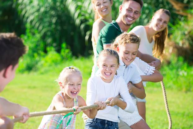 Happy,Kids,With,Parents,Playing,Active,Games,In,Summer,Park,