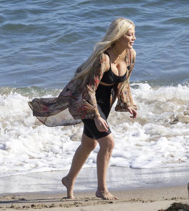 EXCLUSIVE: Mom To The Rescue ! Tori Spelling Jumps Into Action Quickly Saving Her Child After He Is Knocked Over By Strong Waves In The Malibu Surf