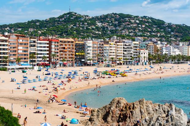 People in the beach of Lloret de Mar after Covid 19 without international tourists in summer 2020