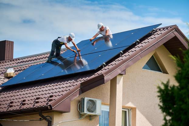 Workers,Building,Photovoltaic,Solar,Panel,System,On,Rooftop,Of,House.