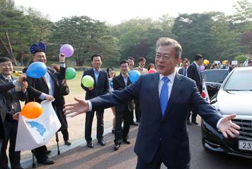 South Korean President Moon Jae-in gestures at the truce village of Panmunjom