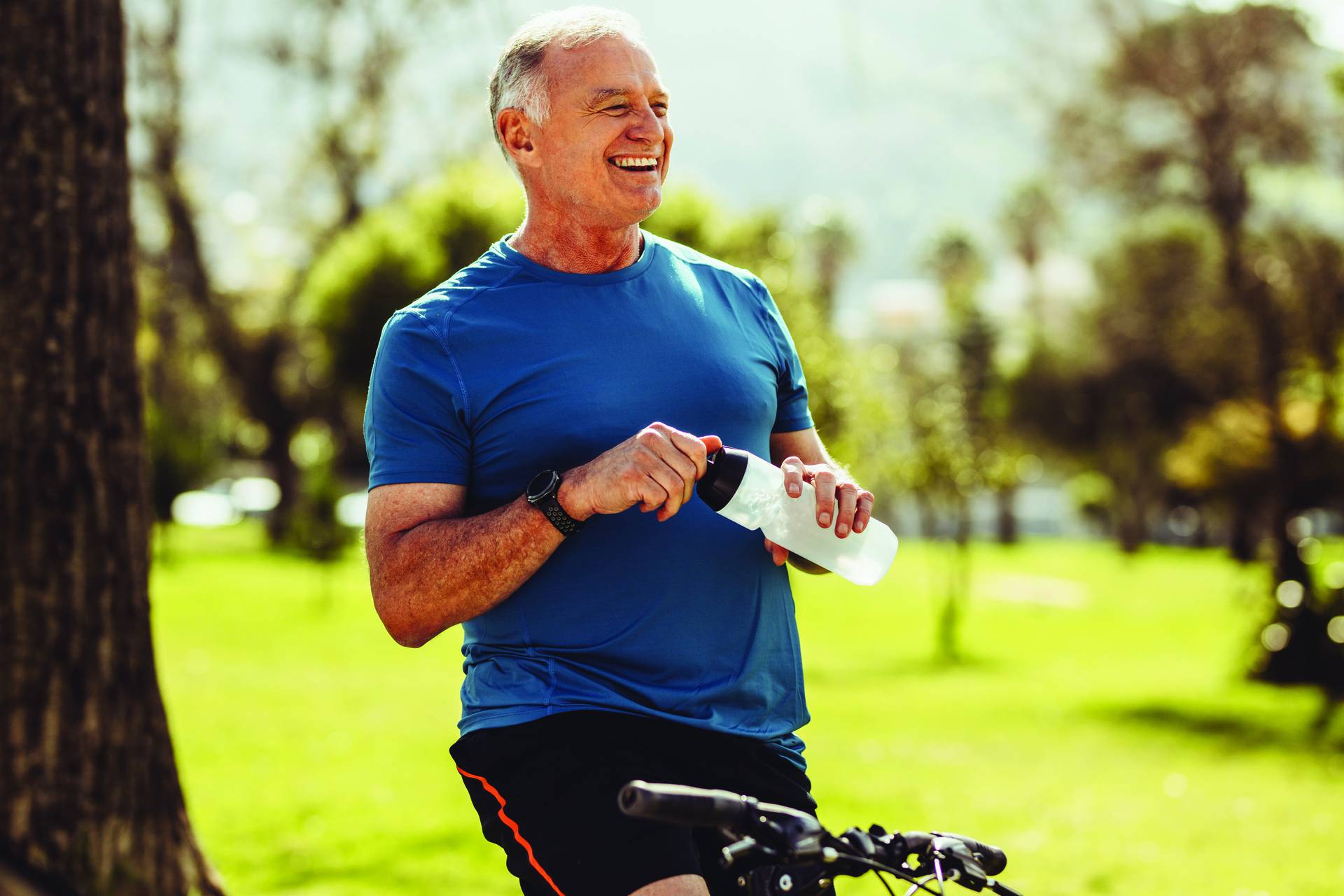 Senior fitness man drinking water