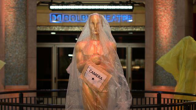 Oscar statues sit covered in plastic at the entrance to the Dolby Theatre as preparations continue for the 89th Academy Awards in Hollywood,