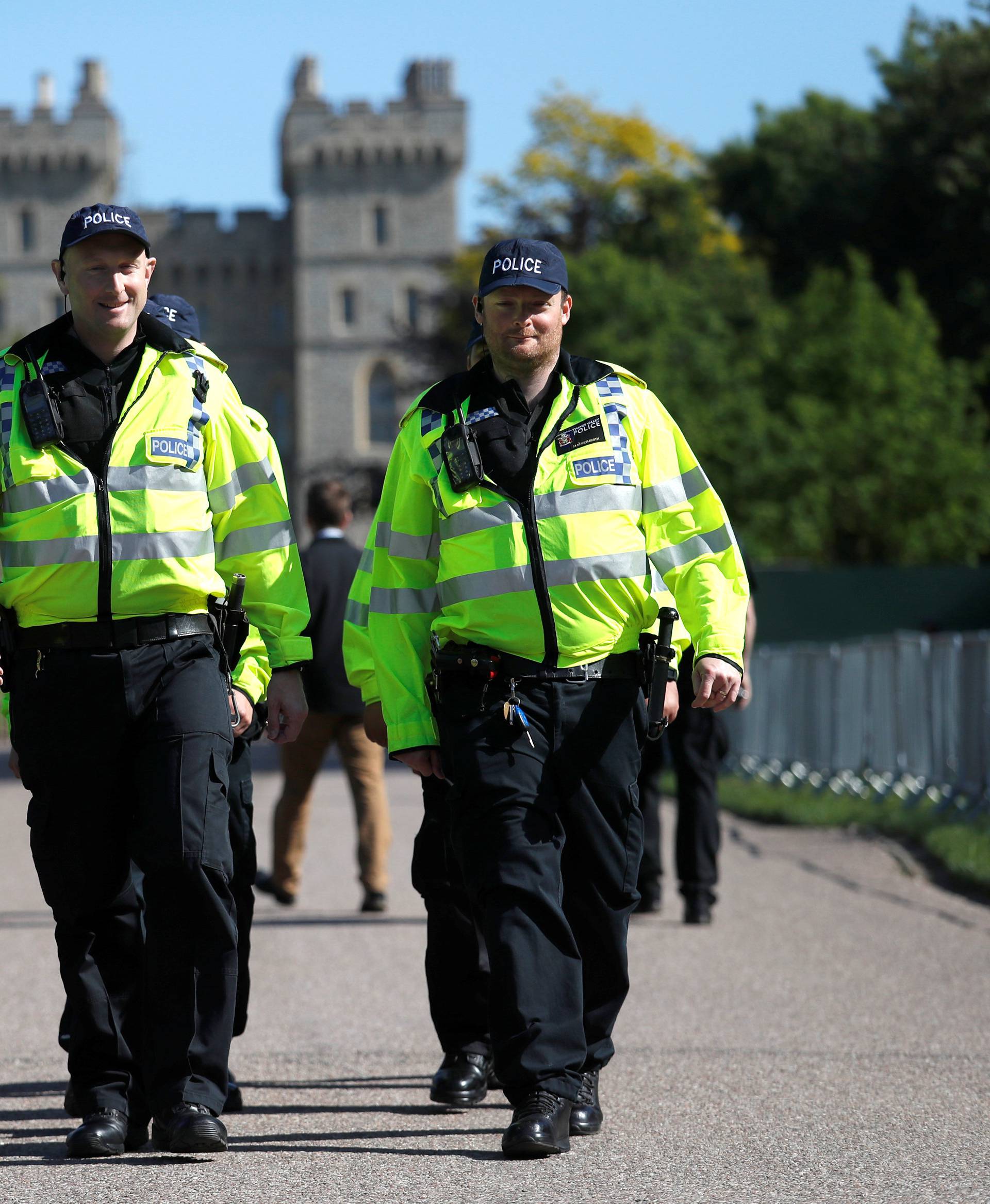 Police officers walk down Long Walk leading away from Windsor Castle before the upcoming wedding of Britain's Prince Harry and Meghan Markle in Windsor