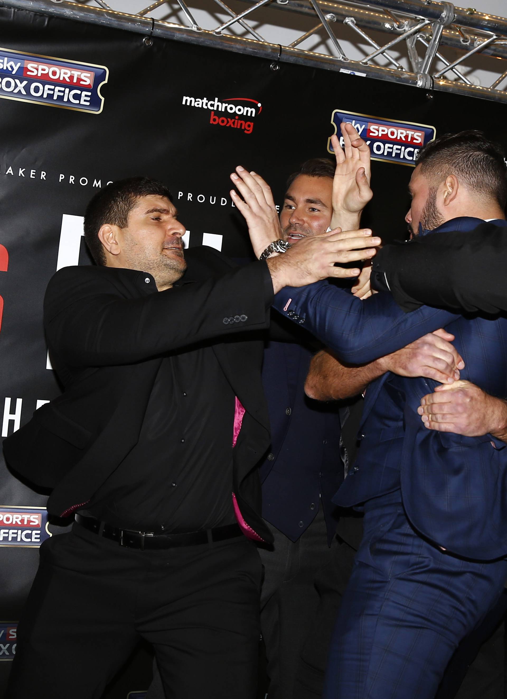 David Haye and Tony Bellew clash after the press conference as promoter Eddie Hearn looks on