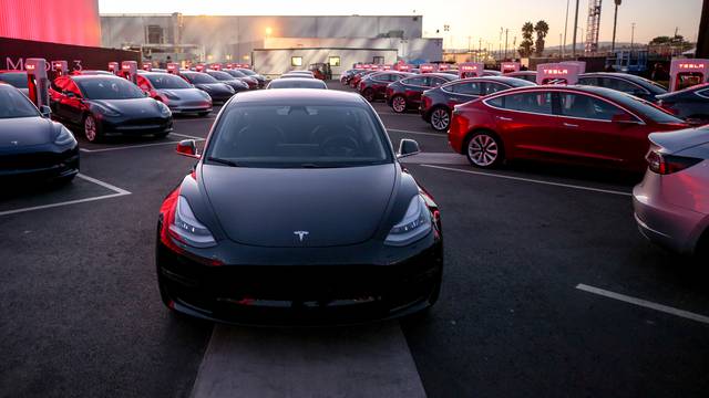 Tesla Model 3 cars are seen as Tesla holds an event at the factory handing over its first 30 Model 3 vehicles to employee buyers at the companyâs Fremont facility in California