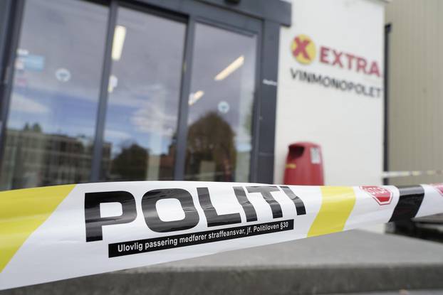Police tape is seen outside a Coop store after a deadly attack in Kongsberg