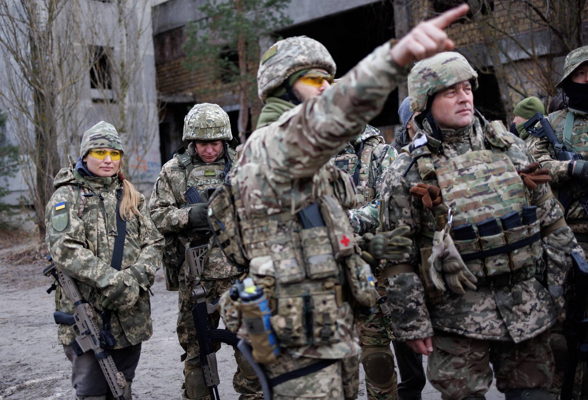 Alisa, a media relations specialist, takes part in a combat skills training conducted by the Territorial Defense Forces near Kyiv