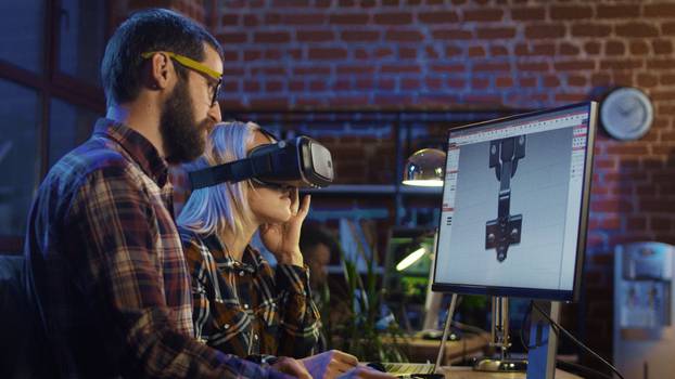 Woman,In,Vr,Glasses,And,Man,Sitting,At,Computer,And