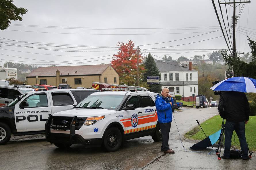 Police vehicles block off the road near the home of Pittsburgh synagogue shooting suspect Robert Bowers' home in Baldwin borough suburb of Pittsburgh