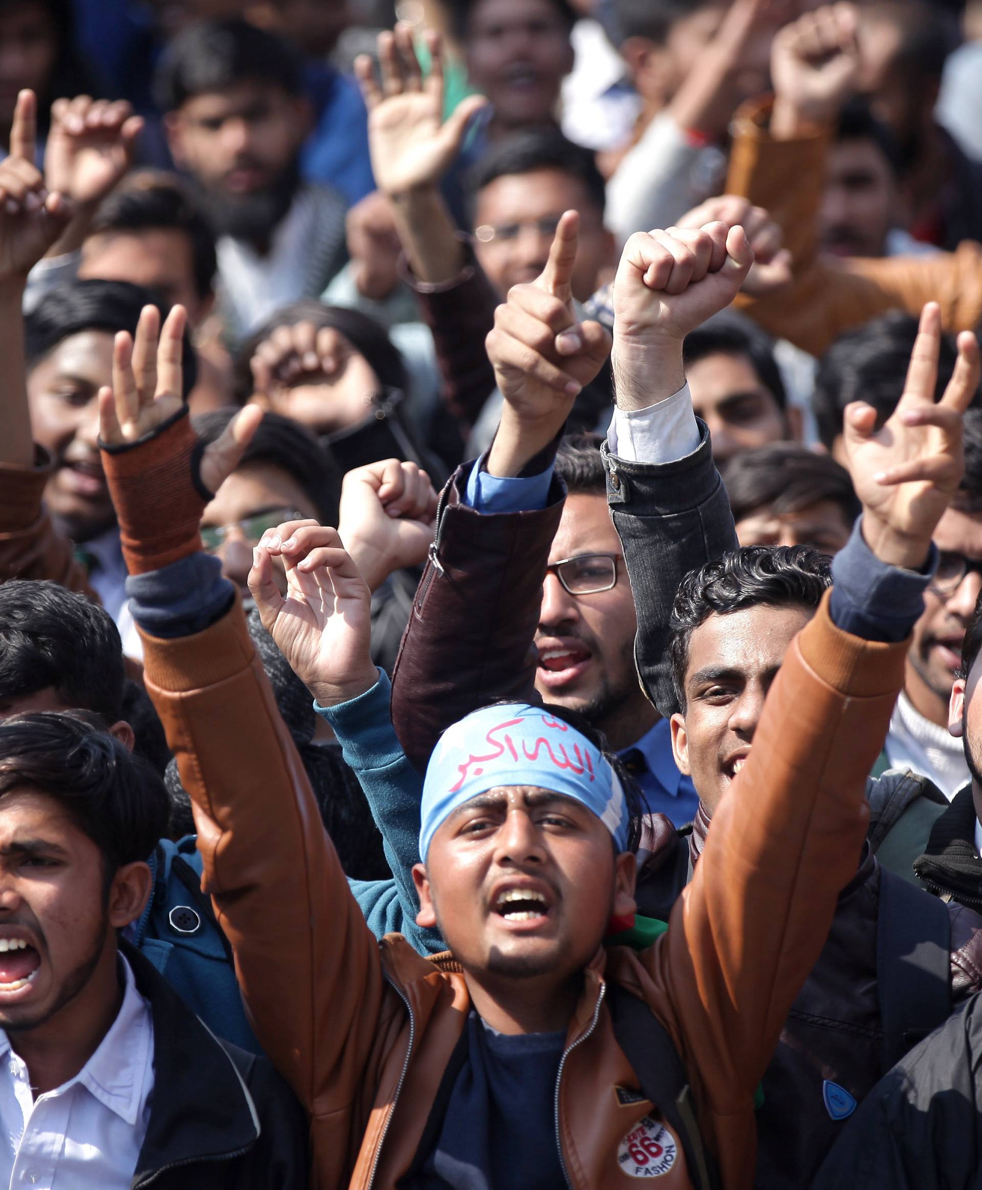 Supporters of Jamiat Talaba Islam chant slogans as they celebrate, after Pakistan shot down two Indian military aircrafts, in Lahore