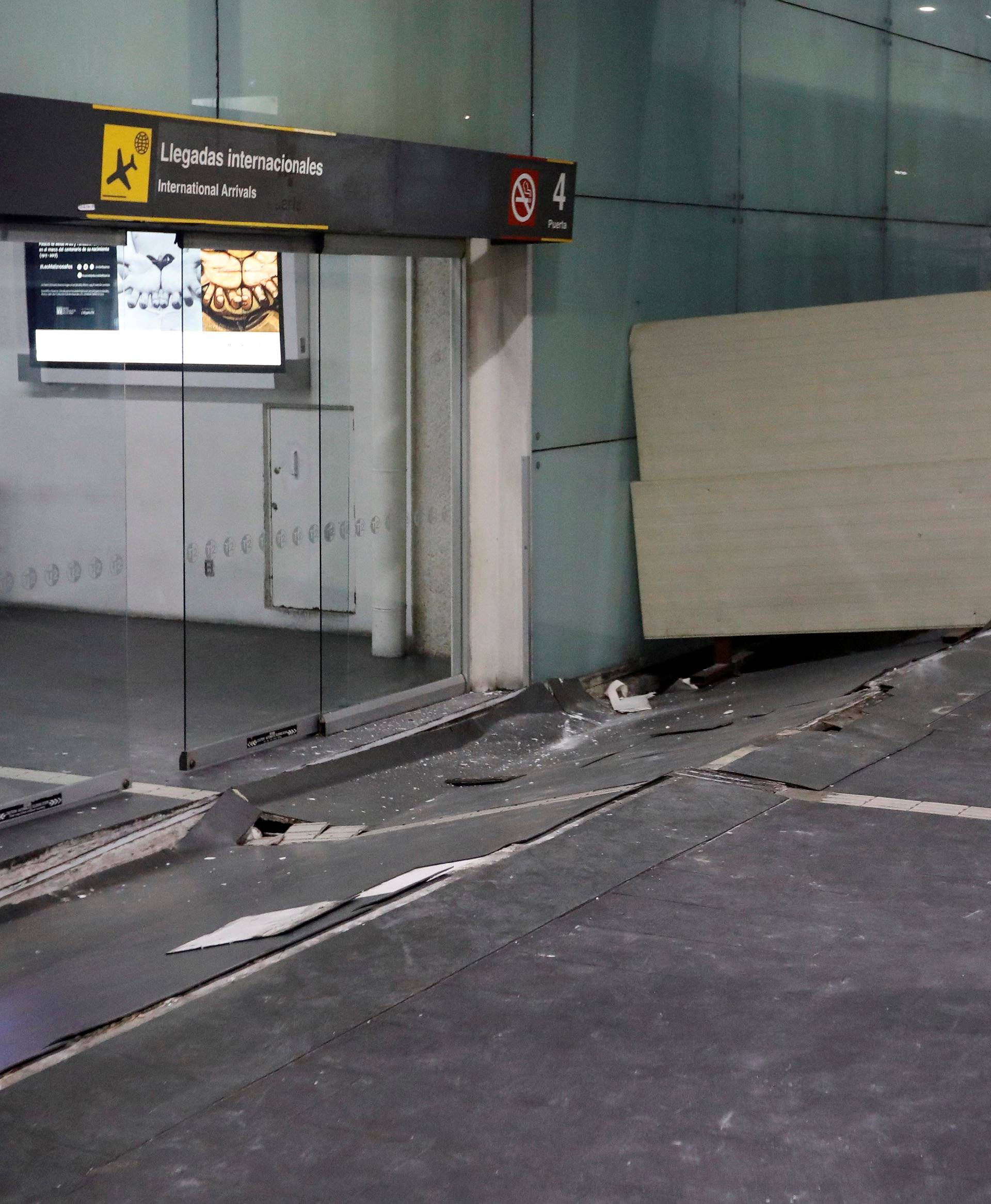 A view of damages on the floor in an entrance of the Benito Juarez international airport after an earthquake hit Mexico City