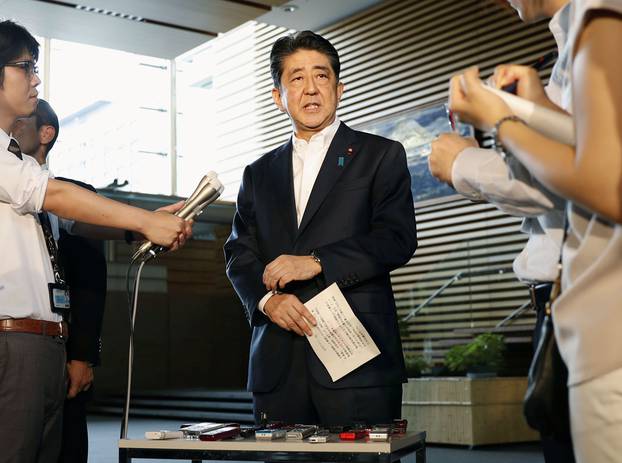 Japanese Prime Minister Shinzo Abe speaks to reporters about North Korea