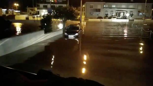 A flooded street is pictured as Storm Elsa sweeps through Trofa, in Porto