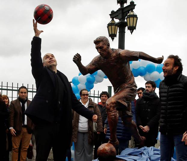 Buenos Aires City Mayor Rodriguez Larreta kicks a ball in front of the statue of Argentina