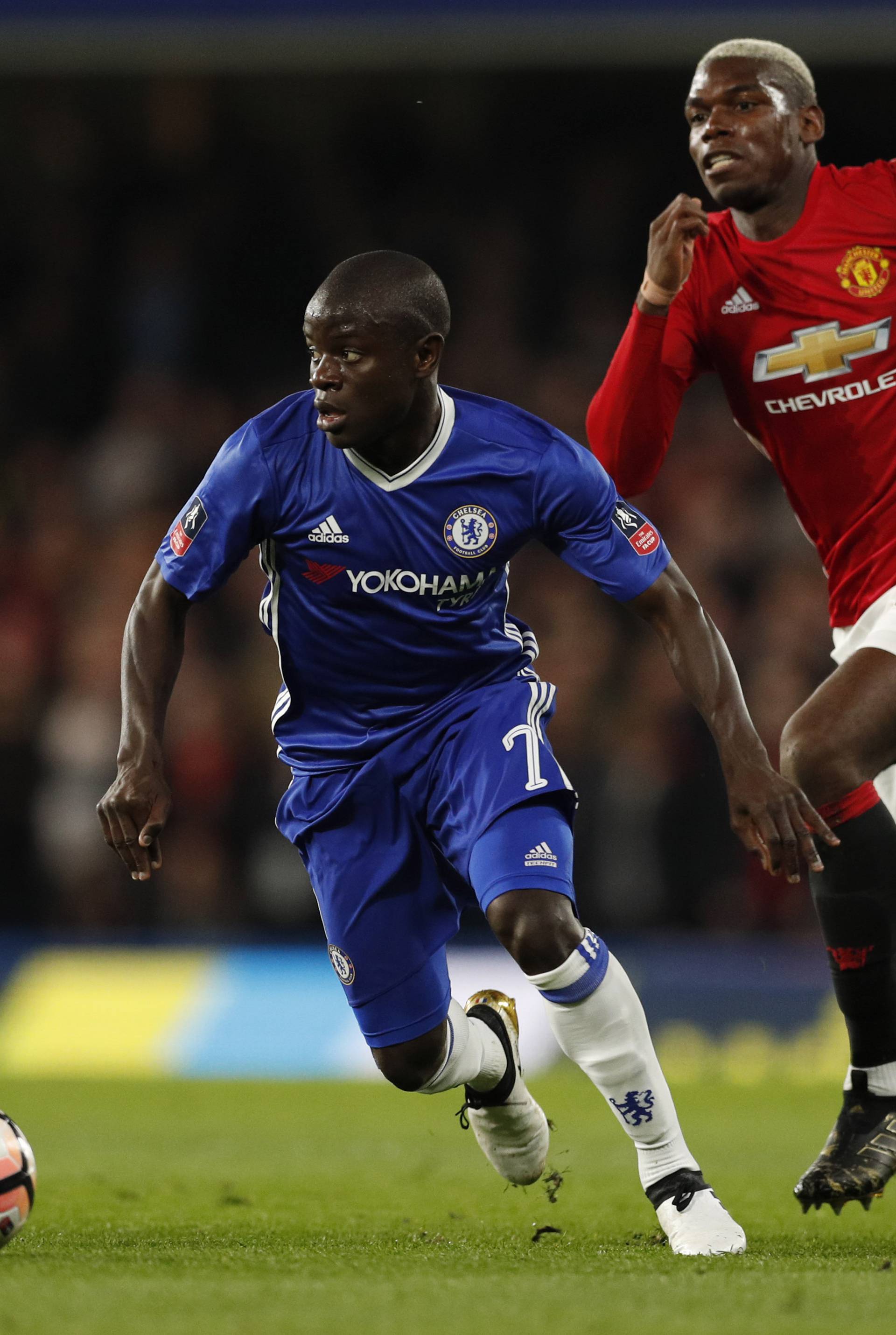Manchester United's Paul Pogba in action with Chelsea's N'Golo Kante