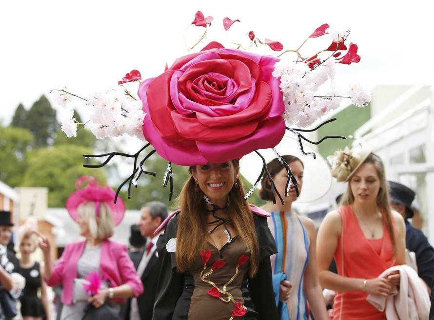 Britain Horse Racing Ladies Day Racegoer wears hat