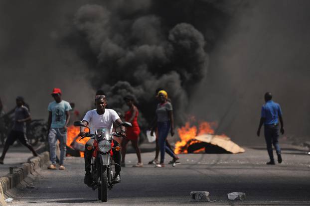 People demonstrate against the government and insecurity in Port-au-Prince