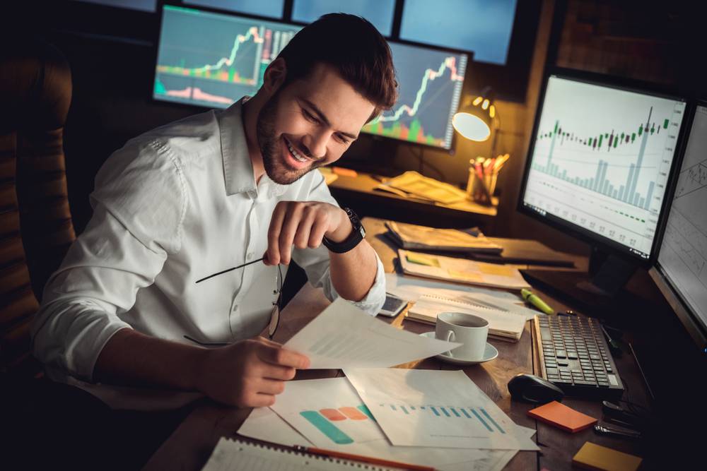 Young,Male,Trader,At,Office,Work,Concept,Sitting,Looking,At