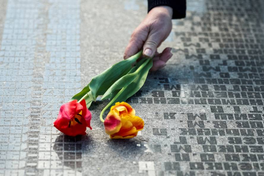 People attend a ceremony marking the anniversary of the Chornobyl nuclear disaster in Kyiv