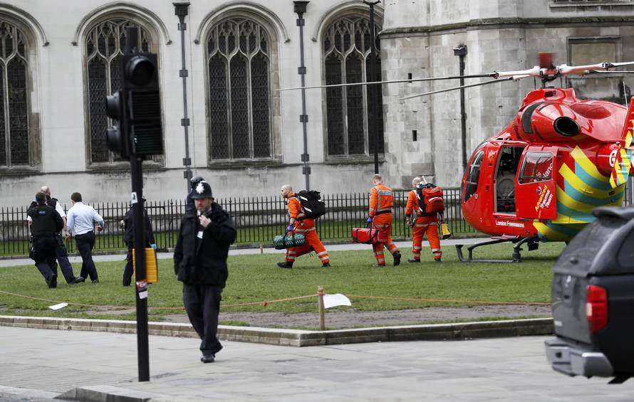 An air ambulance lands in Parliament Square during an incident on Westminster Bridge in London