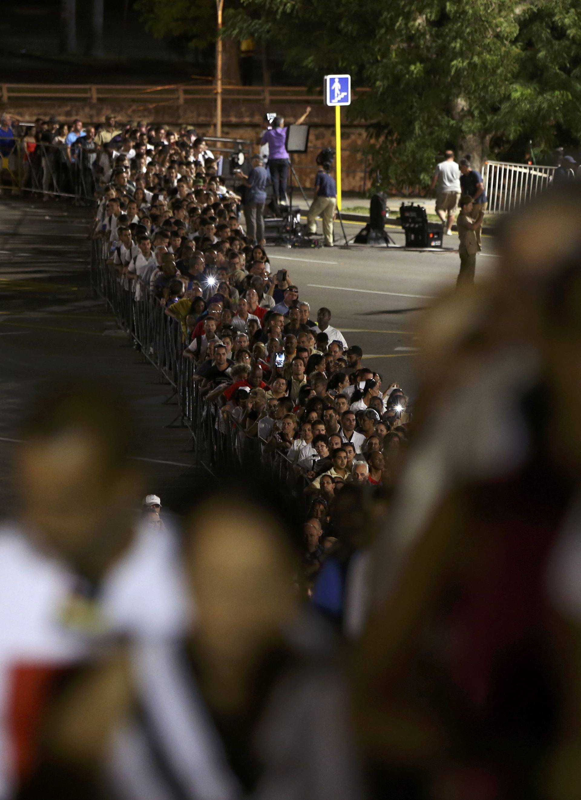 People wait in line to pay tribute to Cuba's late President Fidel Castro at the Jose Marti Memorial in Revolution Square in Havana