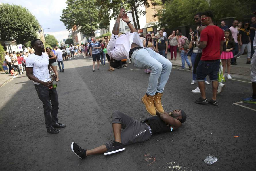 People dance during the Notting Hill Carnival in London