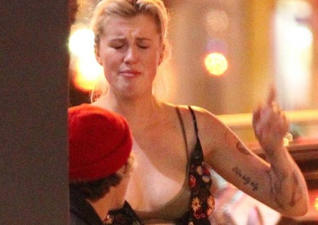 *EXCLUSIVE* Ireland Baldwin appears to argue with unidentified guy on late night outside of Rock & Reillyâs