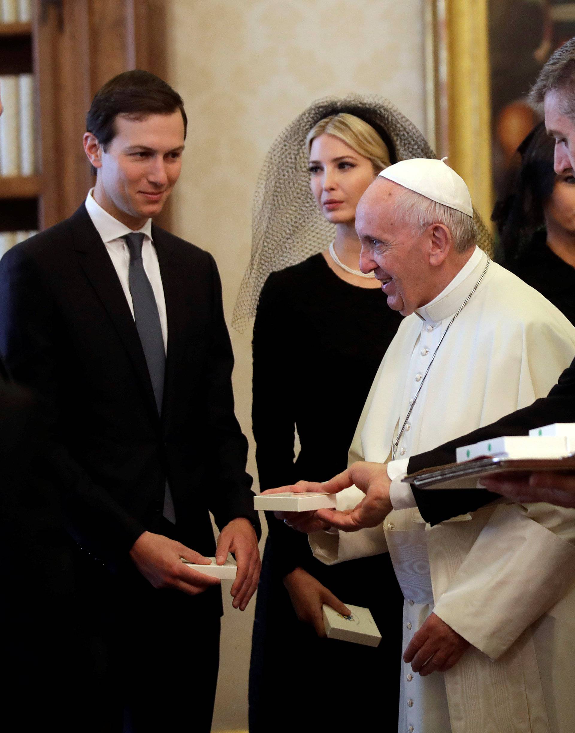 Pope Francis walks past Jared Kushner senior advisor of President Donald Trump, Ivanka Trump, Melania Trump and President Donald Trump during a private audience at the Vatican