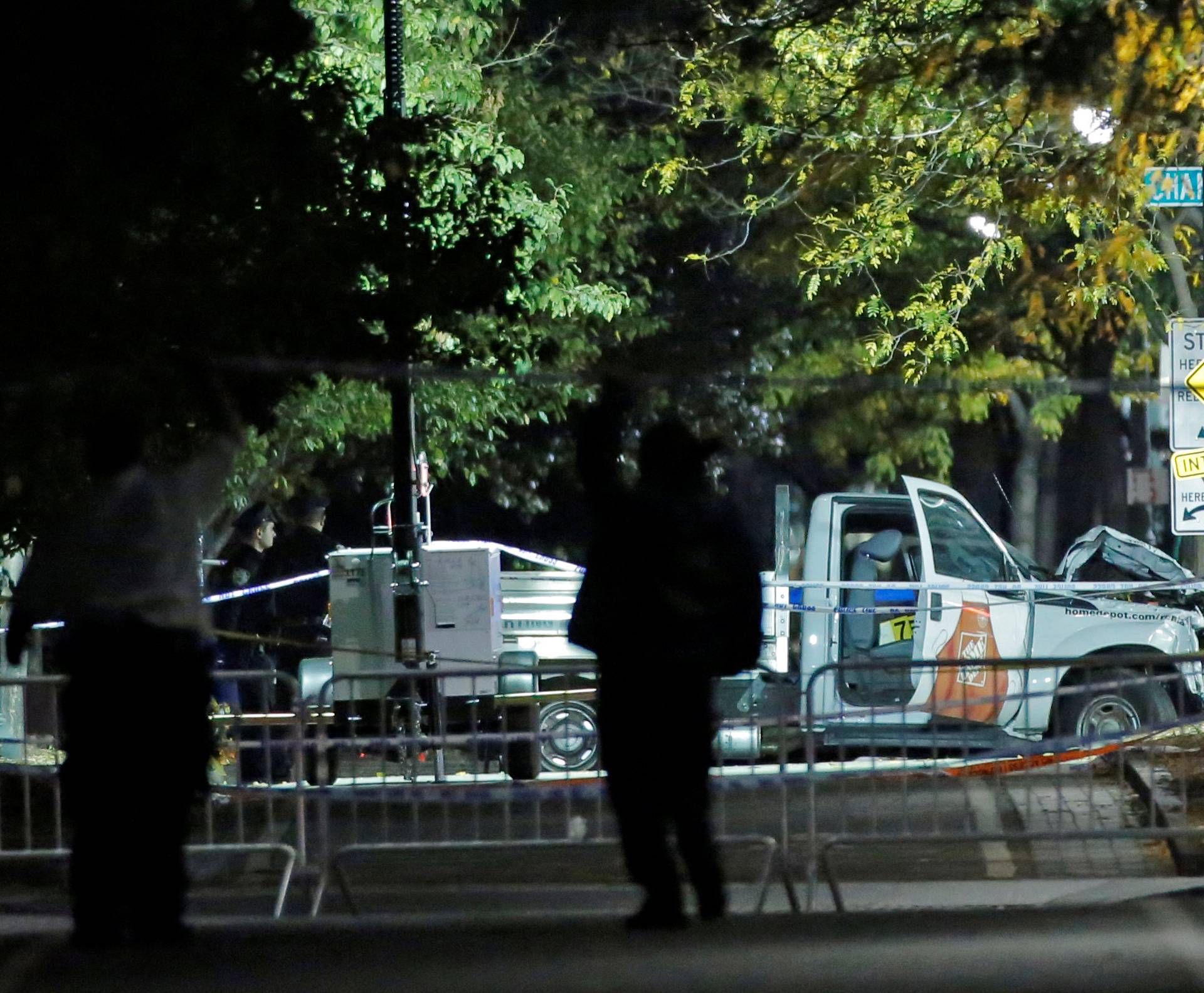 Police investigate the scene of a pickup truck attack on the West Side Highway in Manhattan, New York