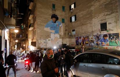 A mural of Argentine soccer legend Diego Maradona is seen in the Spanish Quarter of Naples after the announcement of his death, in Naples