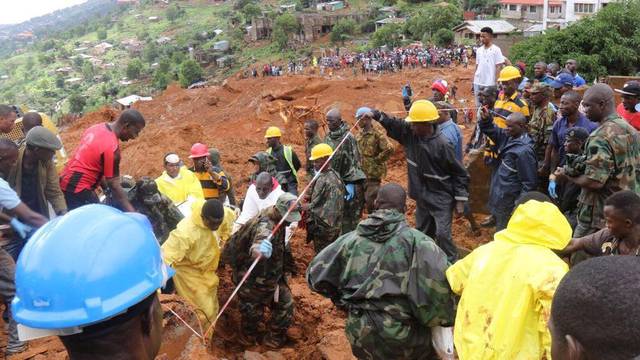 QUALITY REPEAT: Rescue workers search for survivors after a mudslide in the Mountain town of Regent, Sierra Leone