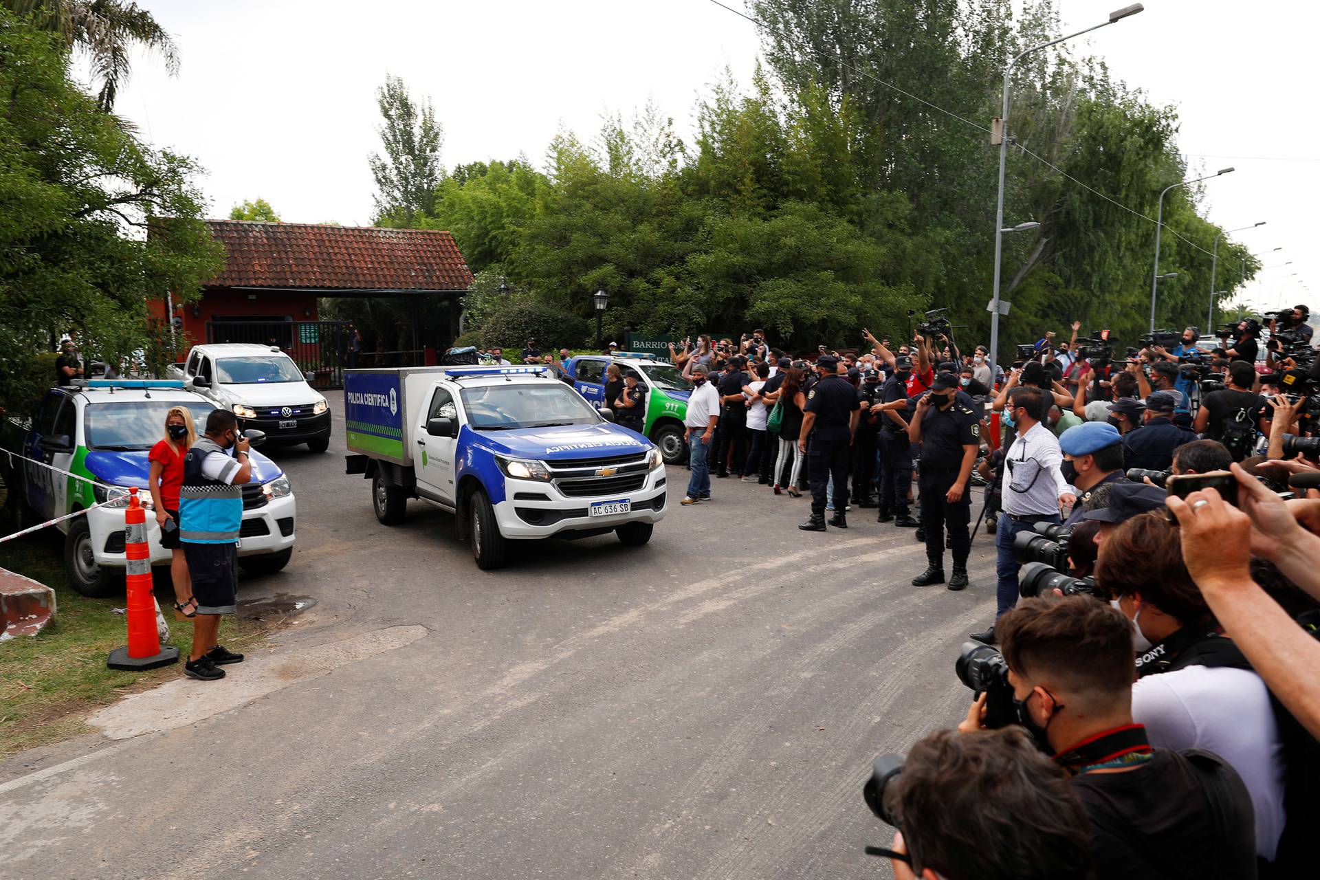 A scientific police vehicle carrying the body of Argentine great Diego Maradona leaves the house where he was staying