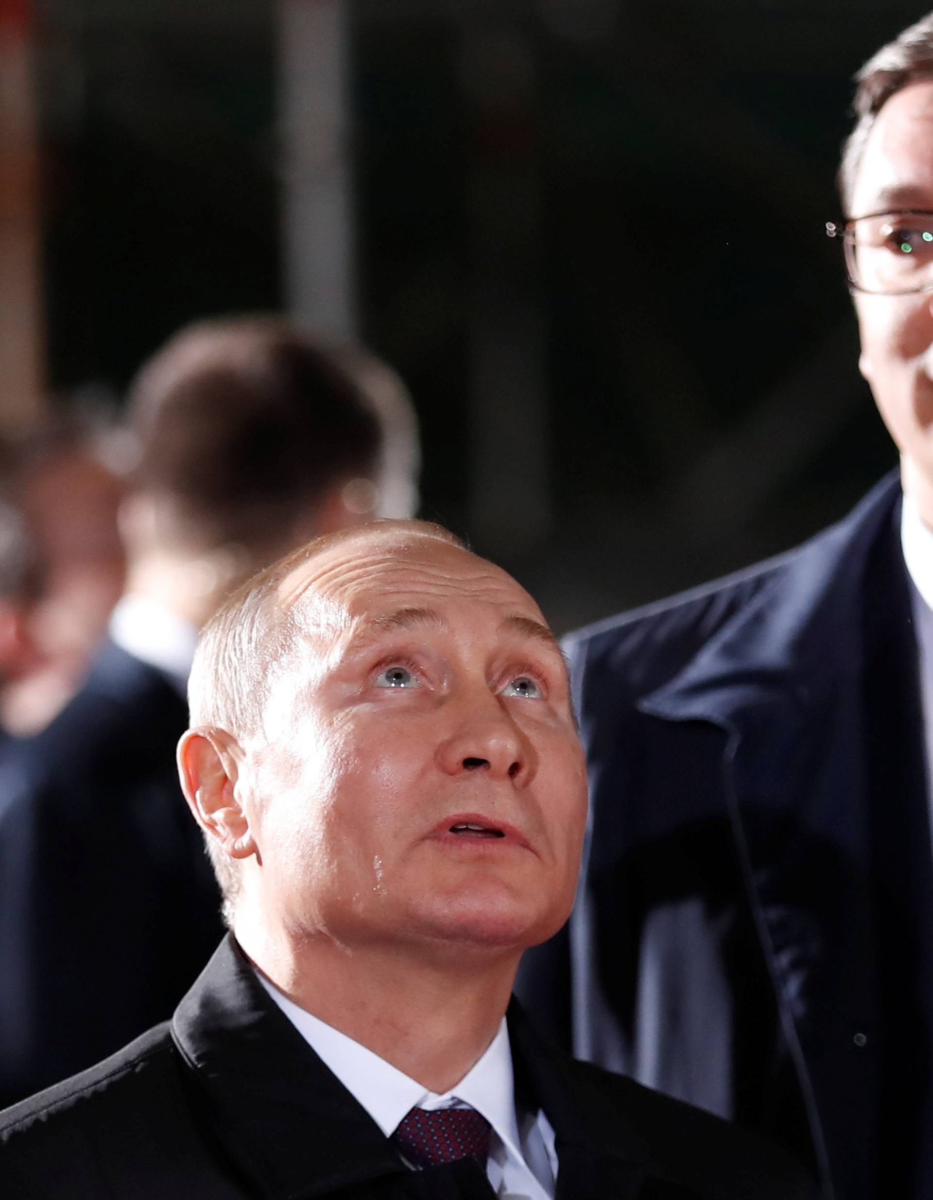 Russian President Vladimir Putin looks up next to Serbian President Aleksandar Vucic in St Sava temple in Belgrade