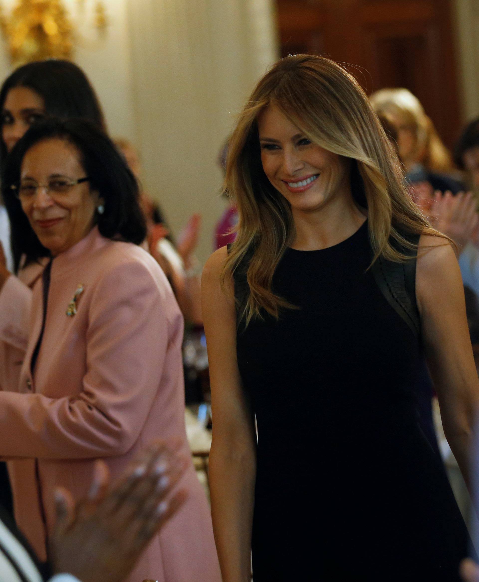U.S. first lady Melania Trump welcomes guests for an International Women's Day luncheon in the State Dining Room at the White House in Washington
