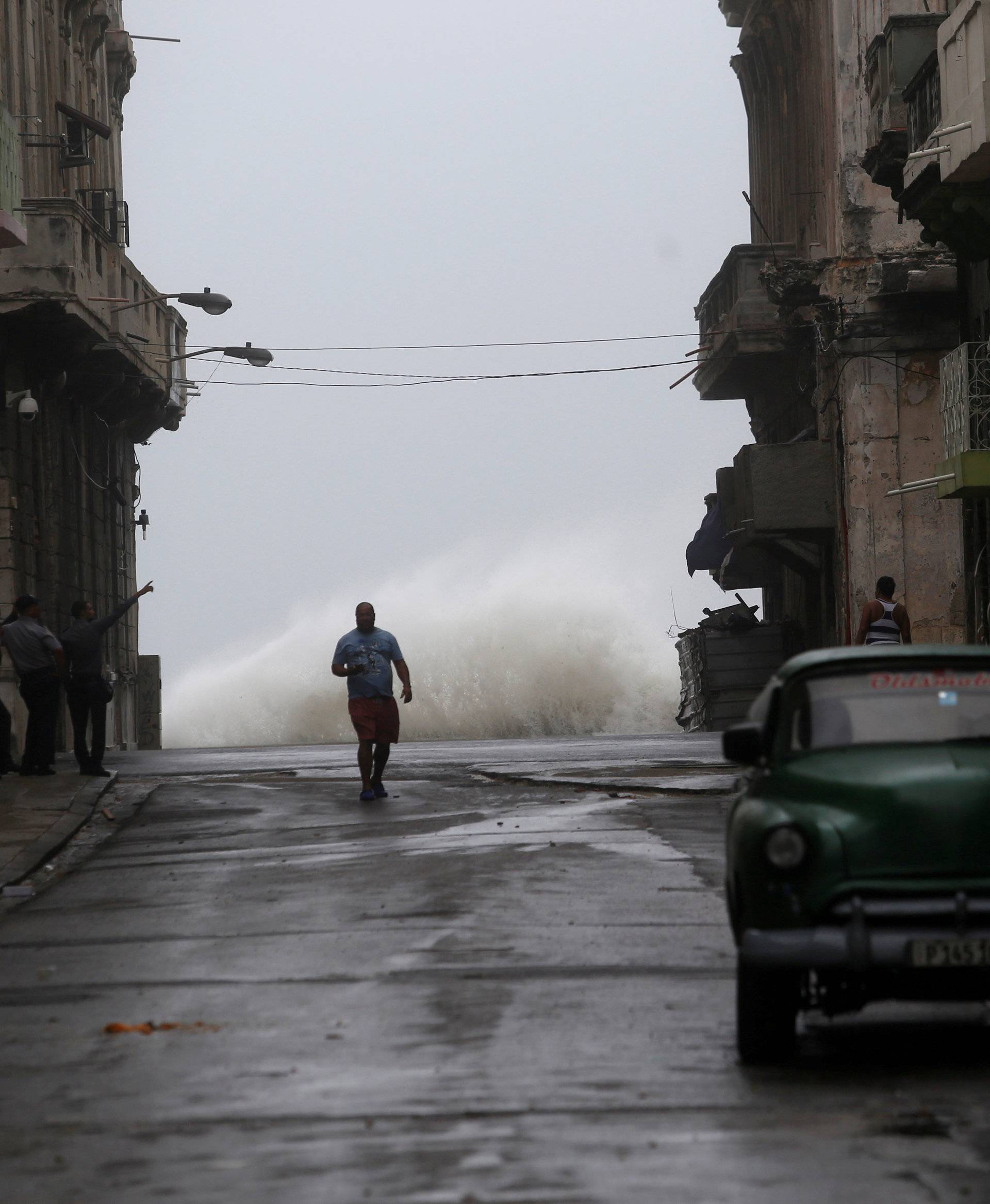 Waves crash on the street as Hurricane Irma turns toward the Florida Keys on Saturday, in Havana