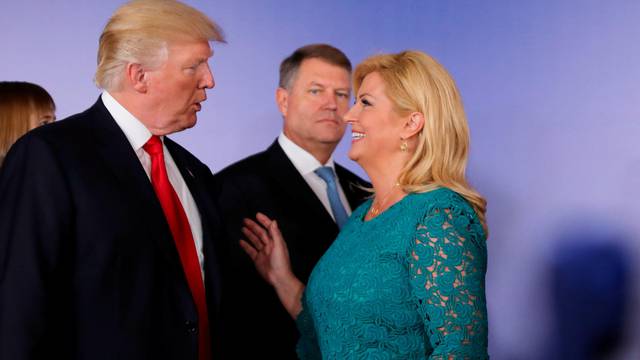 U.S. President Donald Trump talks to Croatian President Kolinda Grabar-Kitarovic during the Three Seas Initiative Summit in Warsaw