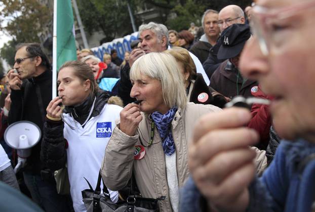 Protesters blow their whistles during an anti-government demonstration in Budapest