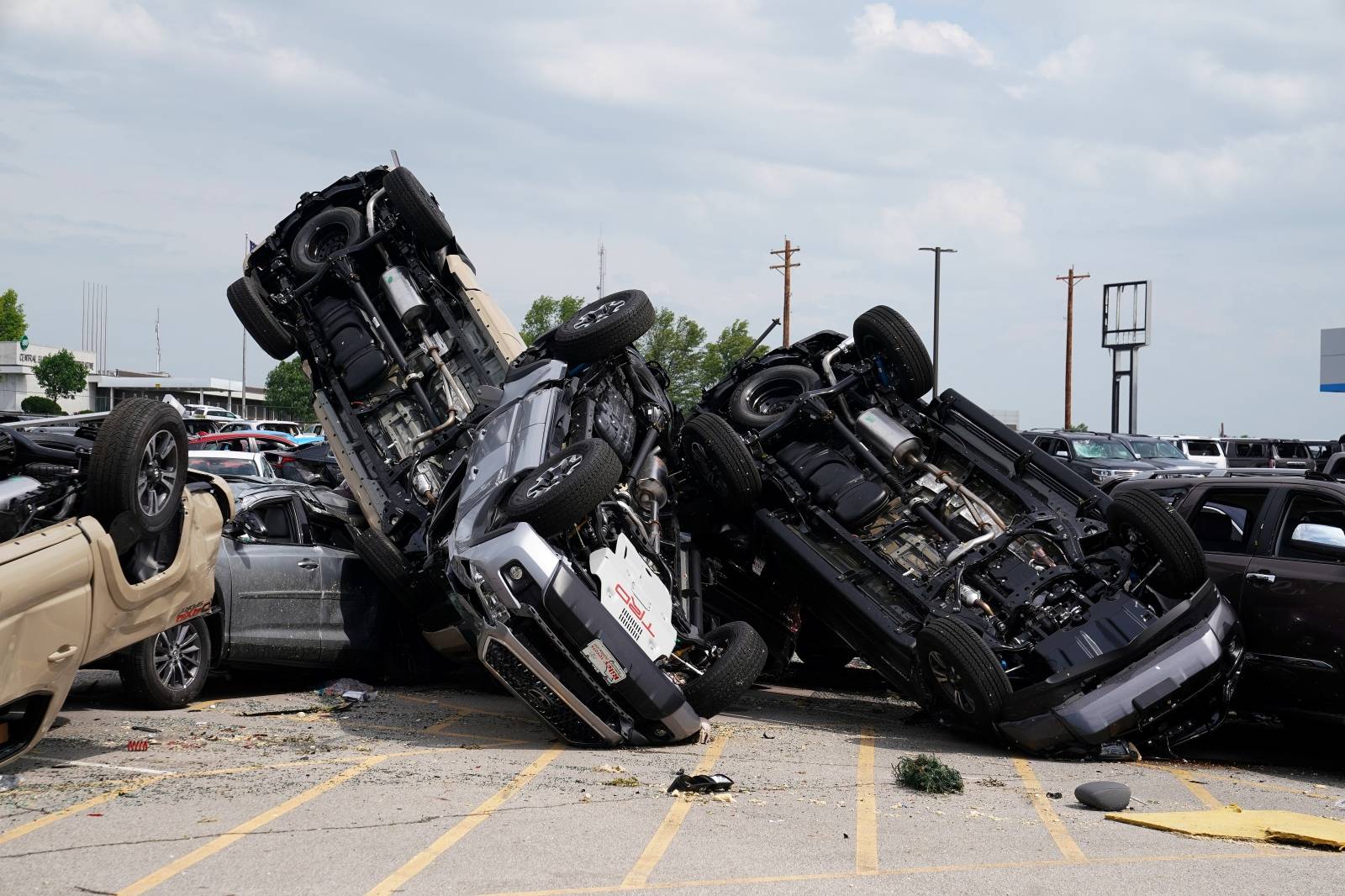 Wrecked vehicles are pictured at a Toyota dealer following a tornado in Jefferson City